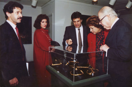 Jewelry designer George Maramenos giving HE the Ambassador of Greece and Mrs. George Papoulias the grand tour of his designs at Zygos Gallery.